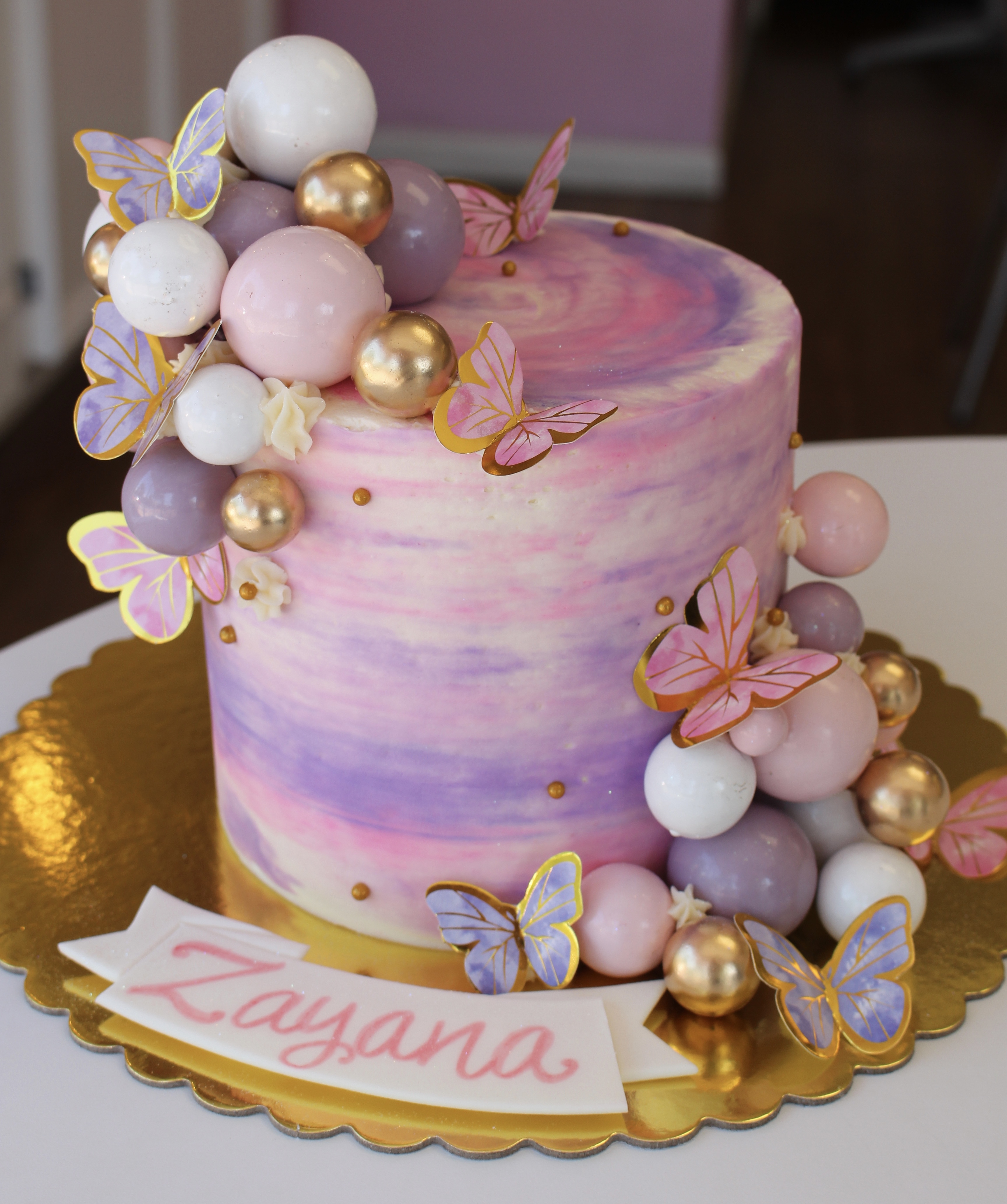 Balloons and Butterflies Cake with Pink and Purple Watercolor Buttercream with Balloons and Ethereal Butterflies