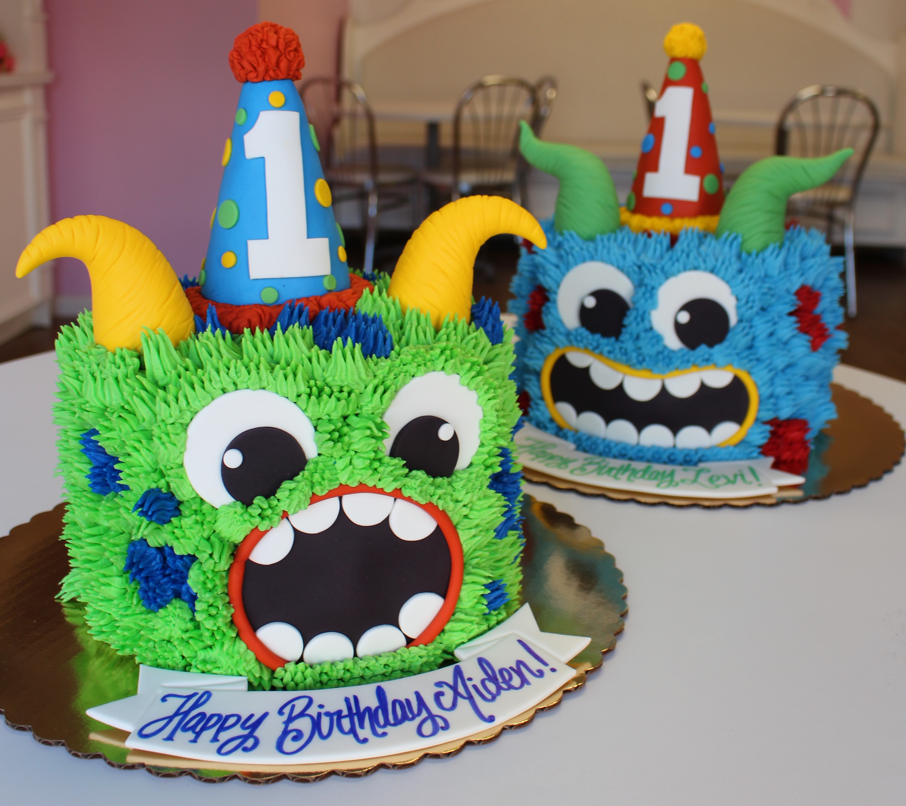Blue and Green Monster Cakes with Hand Piped Monster Fur and Fondant Horns and Party Hats