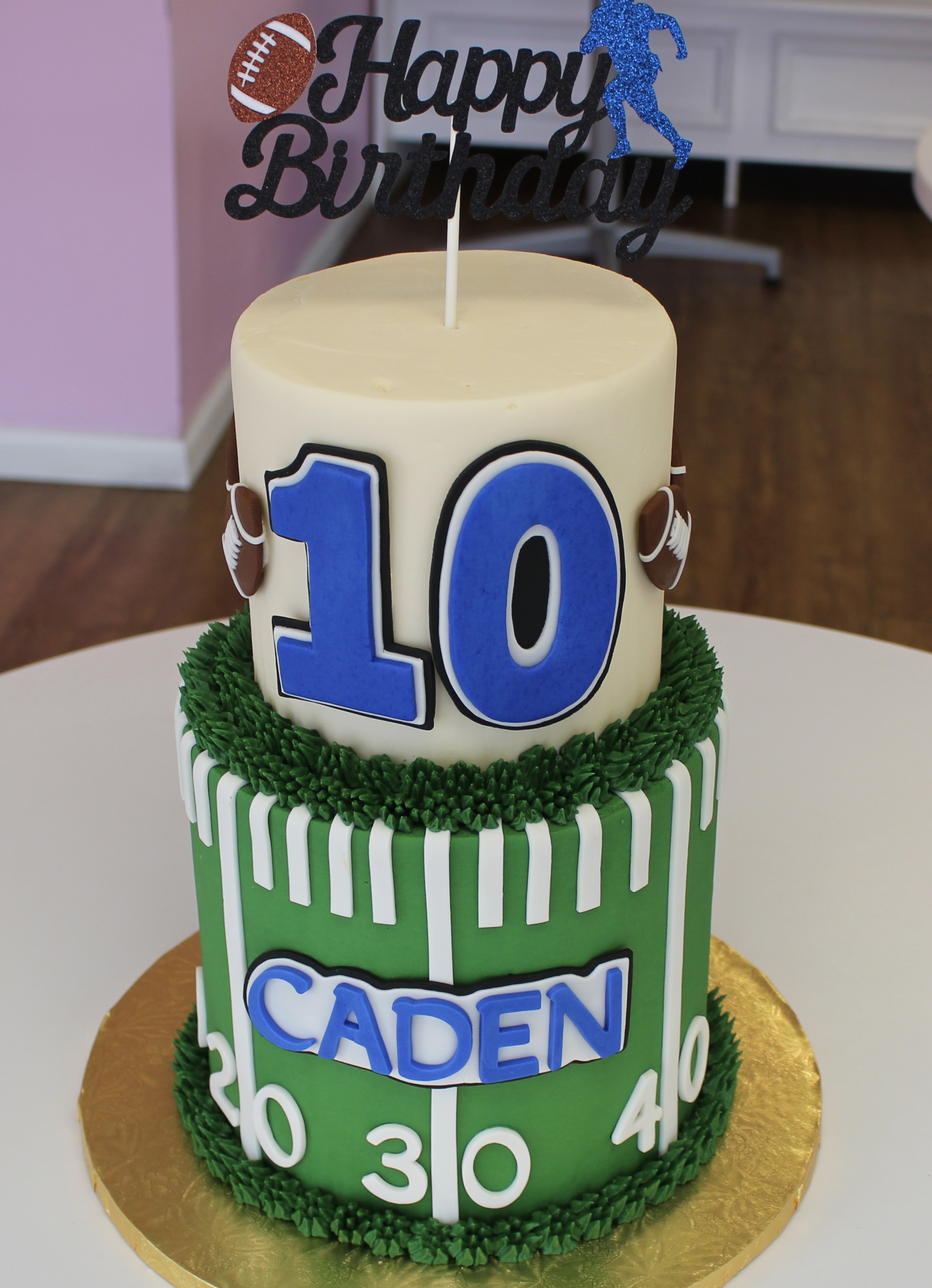 Green and White Two Tier Football Themed Kids Birthday Cake with Fondant Footballs Jersey Number and Football Field