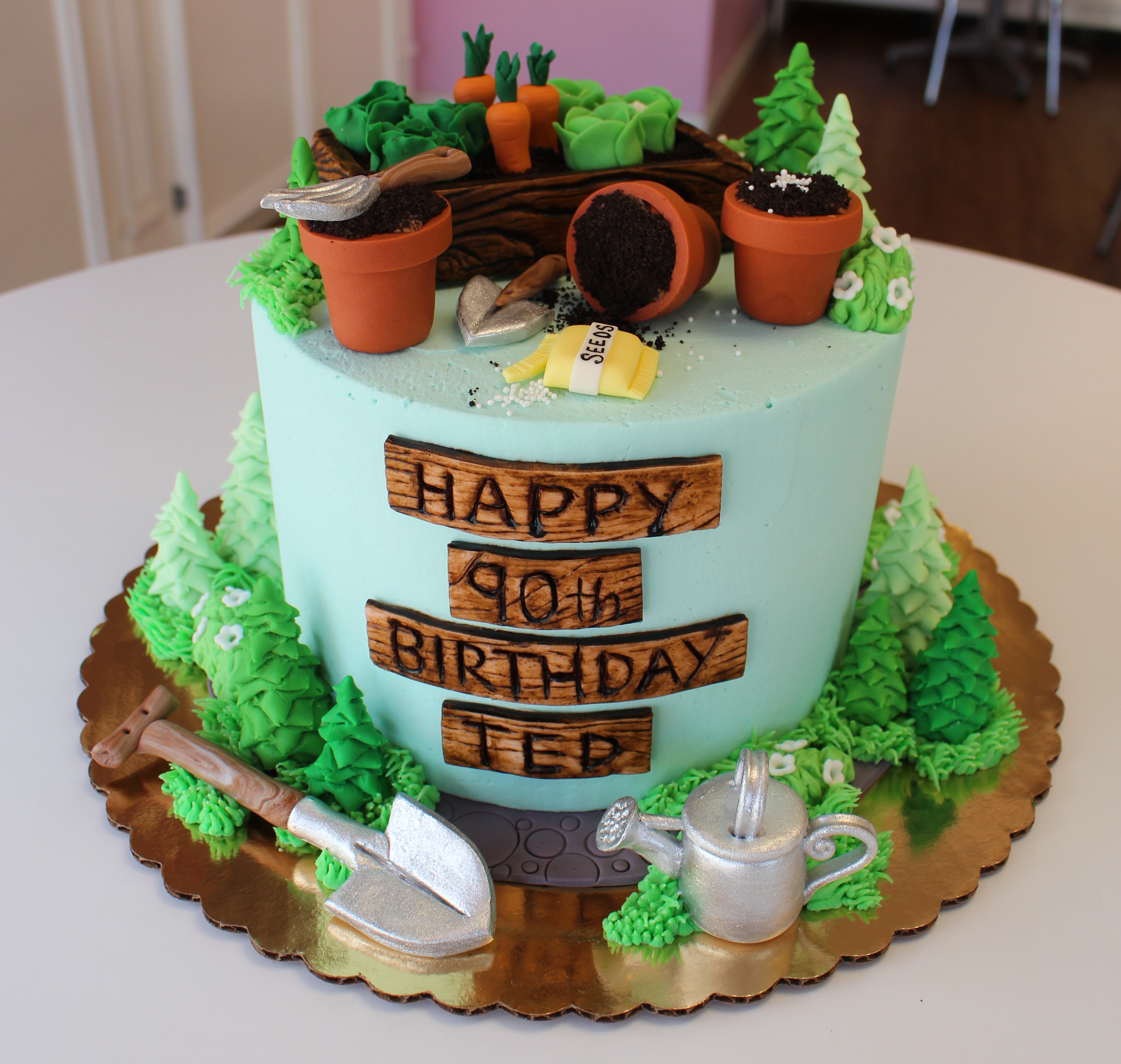 Light Blue Garden Theme Birthday Cake with Fondant Flowers, Plants, Pots, Tools, and Watering Can