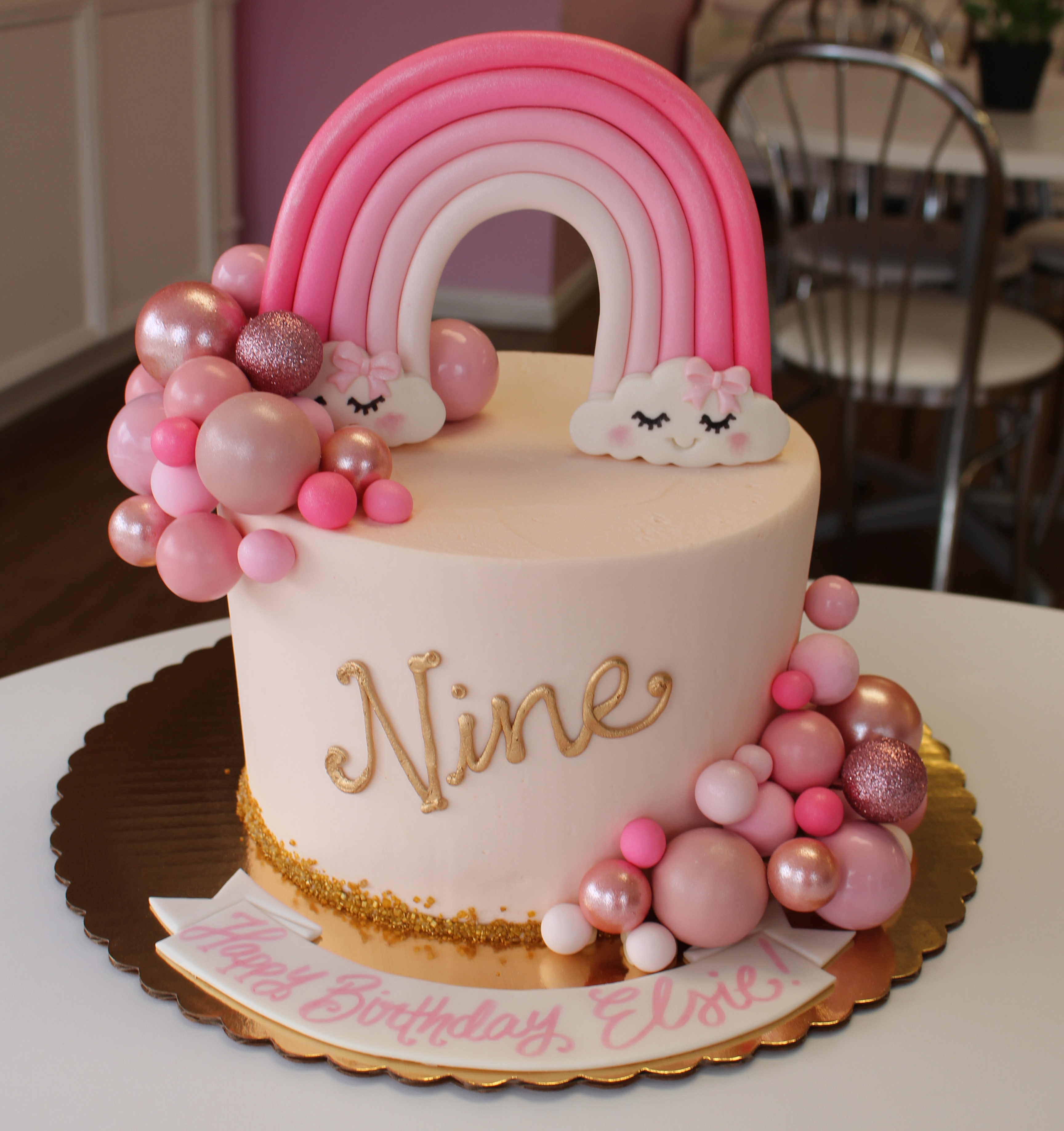 Light Pink Girls Birthday Cake with Balloons and Pink Fondant Rainbow