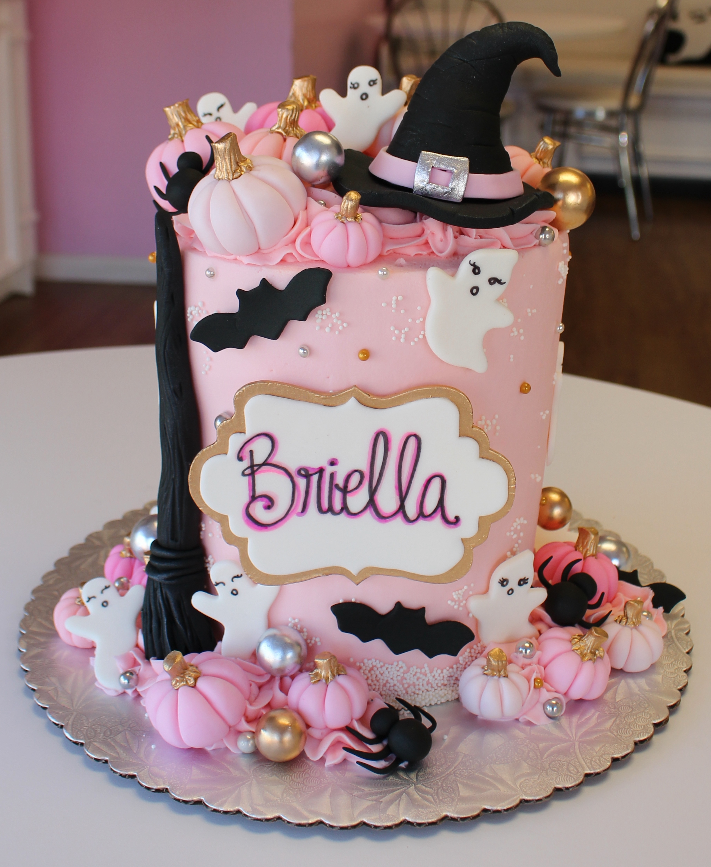 Light Pink Spooky Halloween Theme Kids Birthday Cake with Fondant Witchs Hat Broom Ghosts and Pink Pumpkins