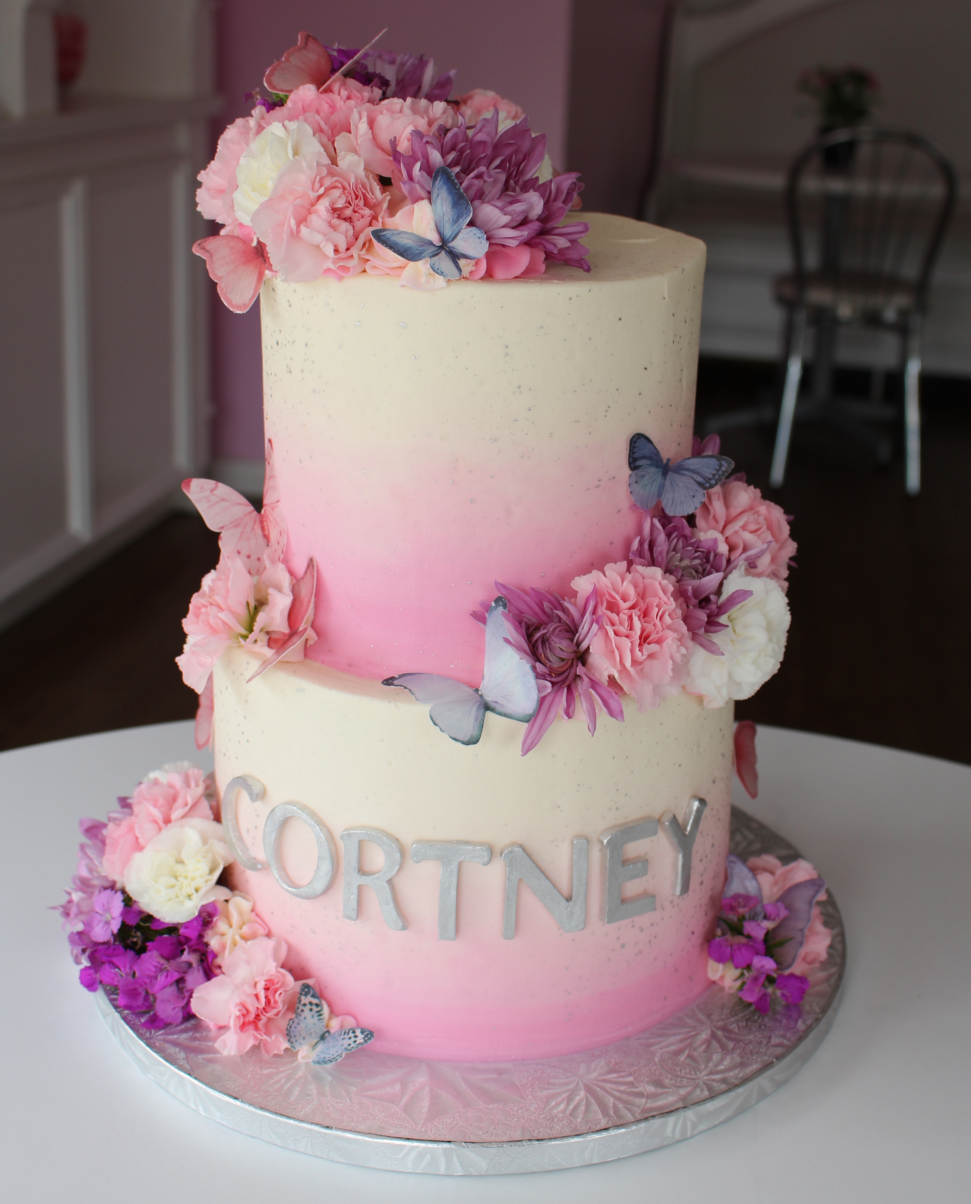 Pink and White Ombre Elegant Birthday Cake with Butterflies and Silk Flowers