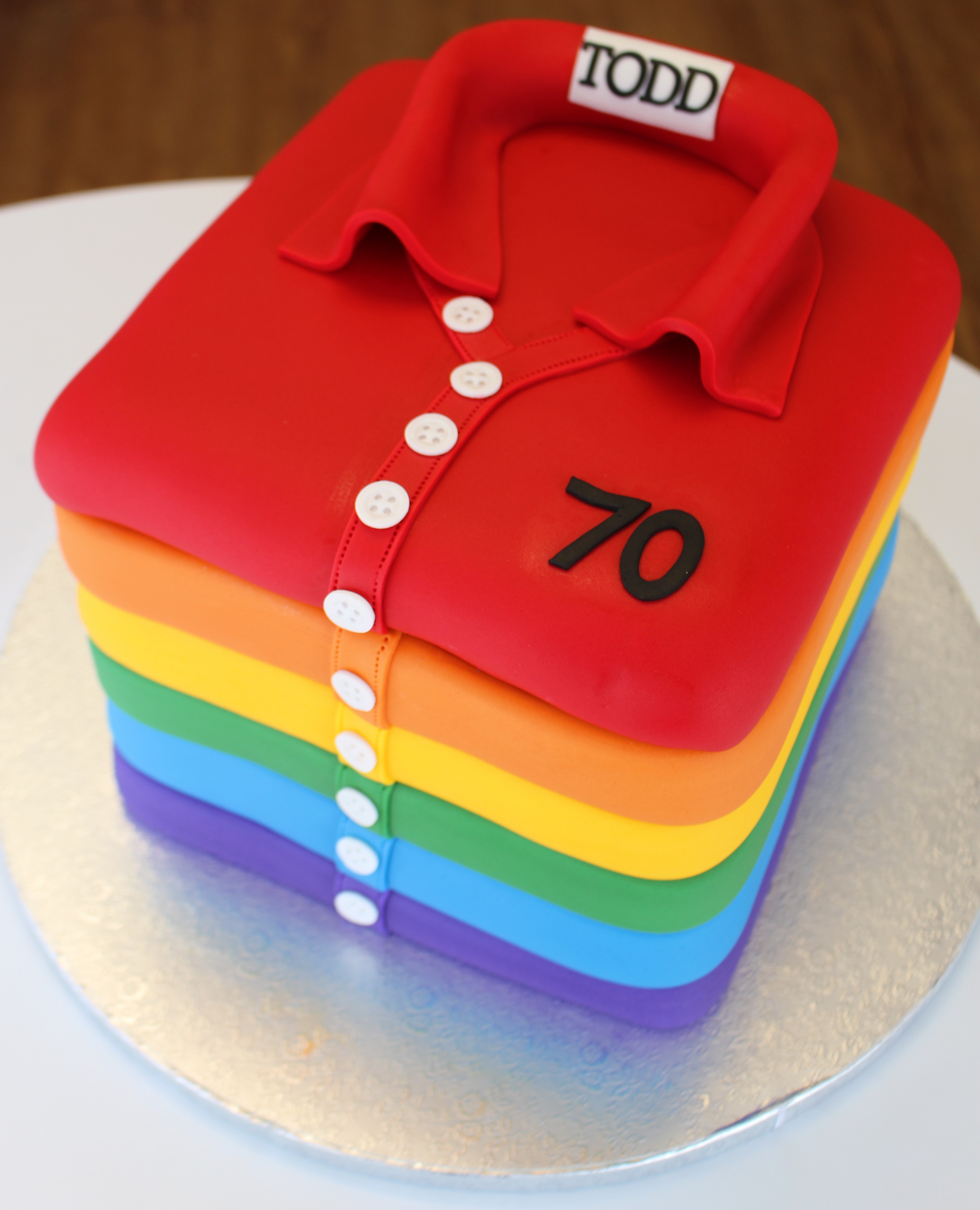 Rainbow Folded Stack of Shirts Birthday Cake