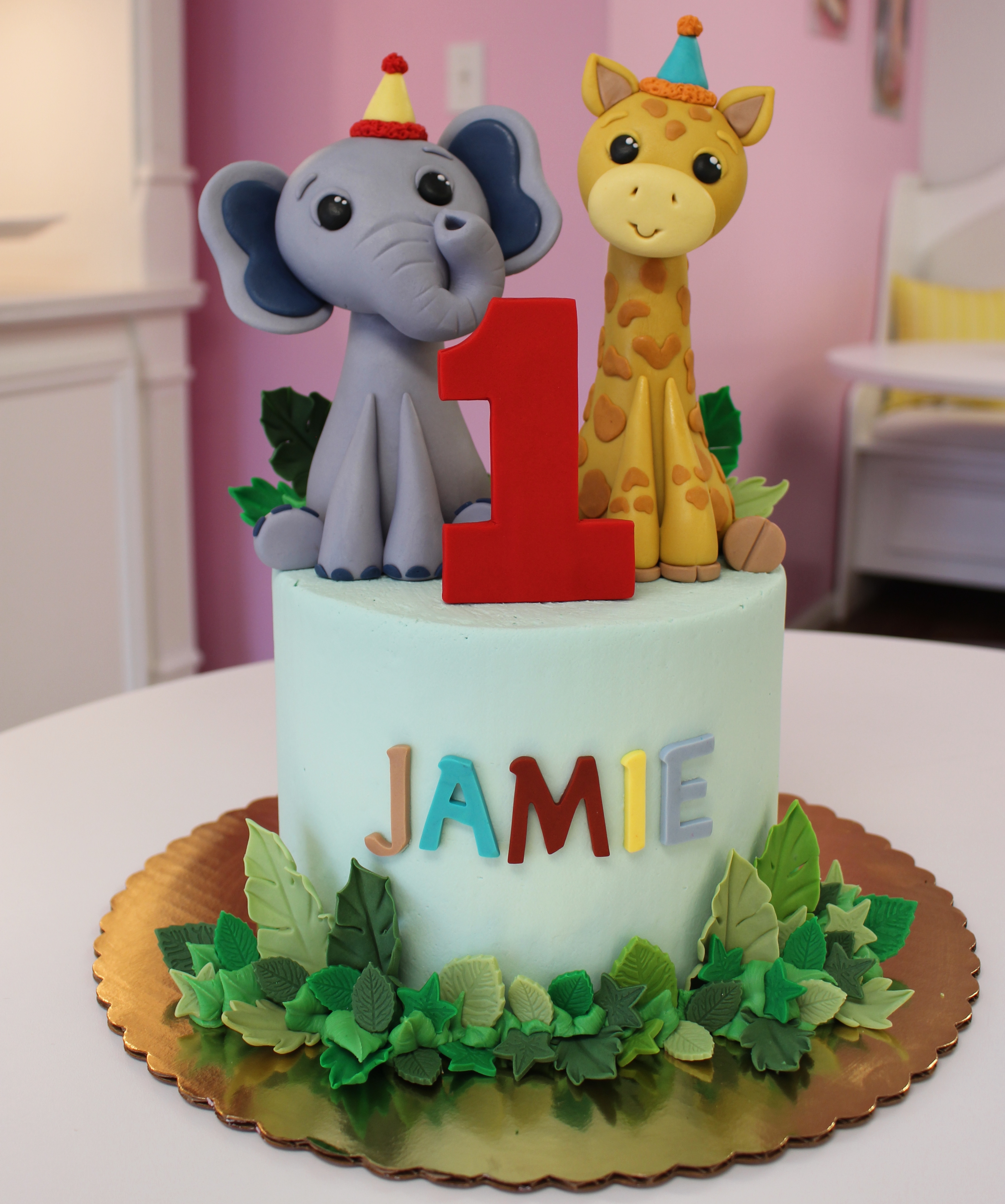 Safari Animal Theme First Birthday Cake with Cute Fondant Jungle Leaves, Elephant, and Giraffe