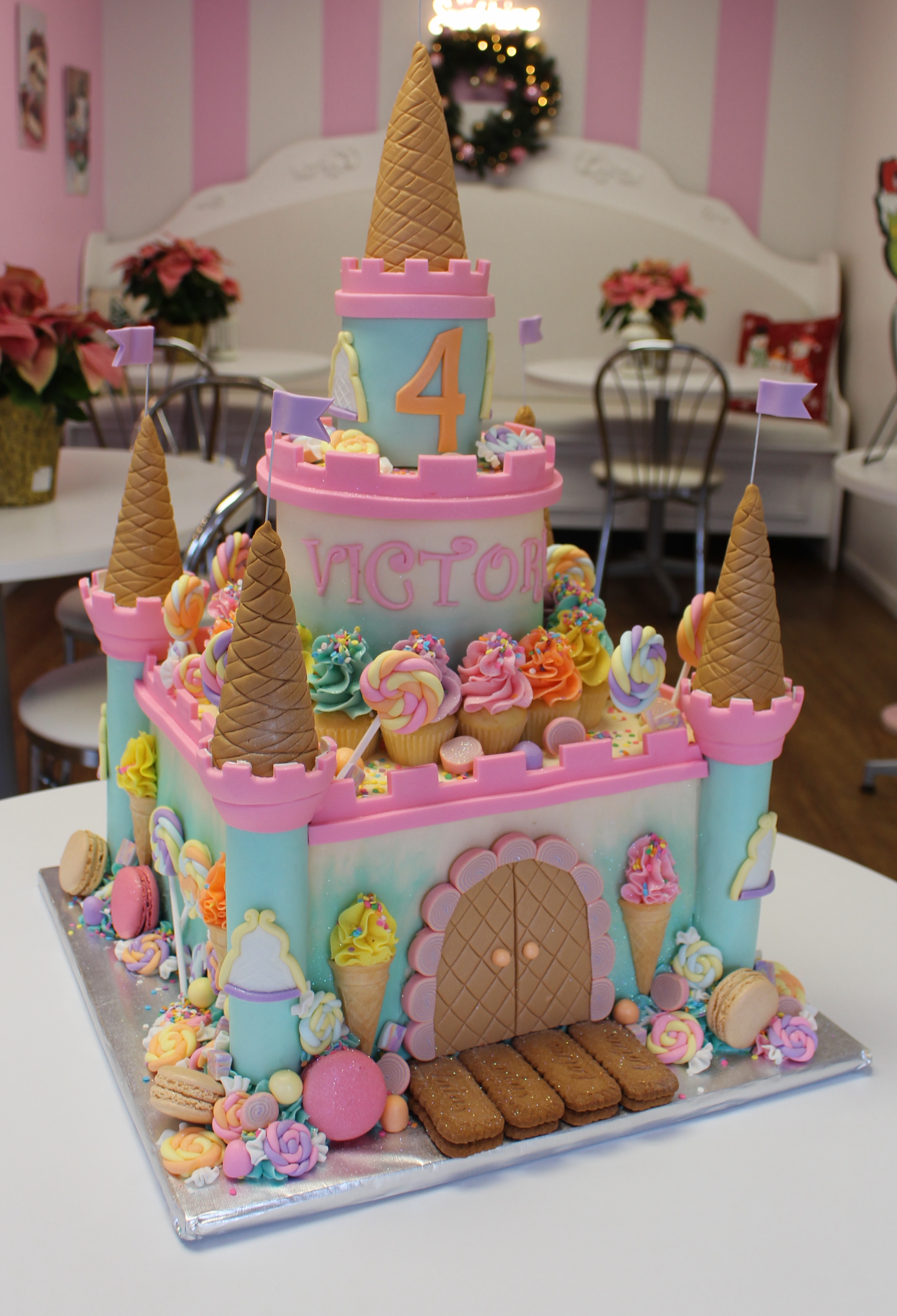 Three Tier Candy Castle Kids Birthday Cake with Mini Cupcakes Macarons and Matching Sugarwork