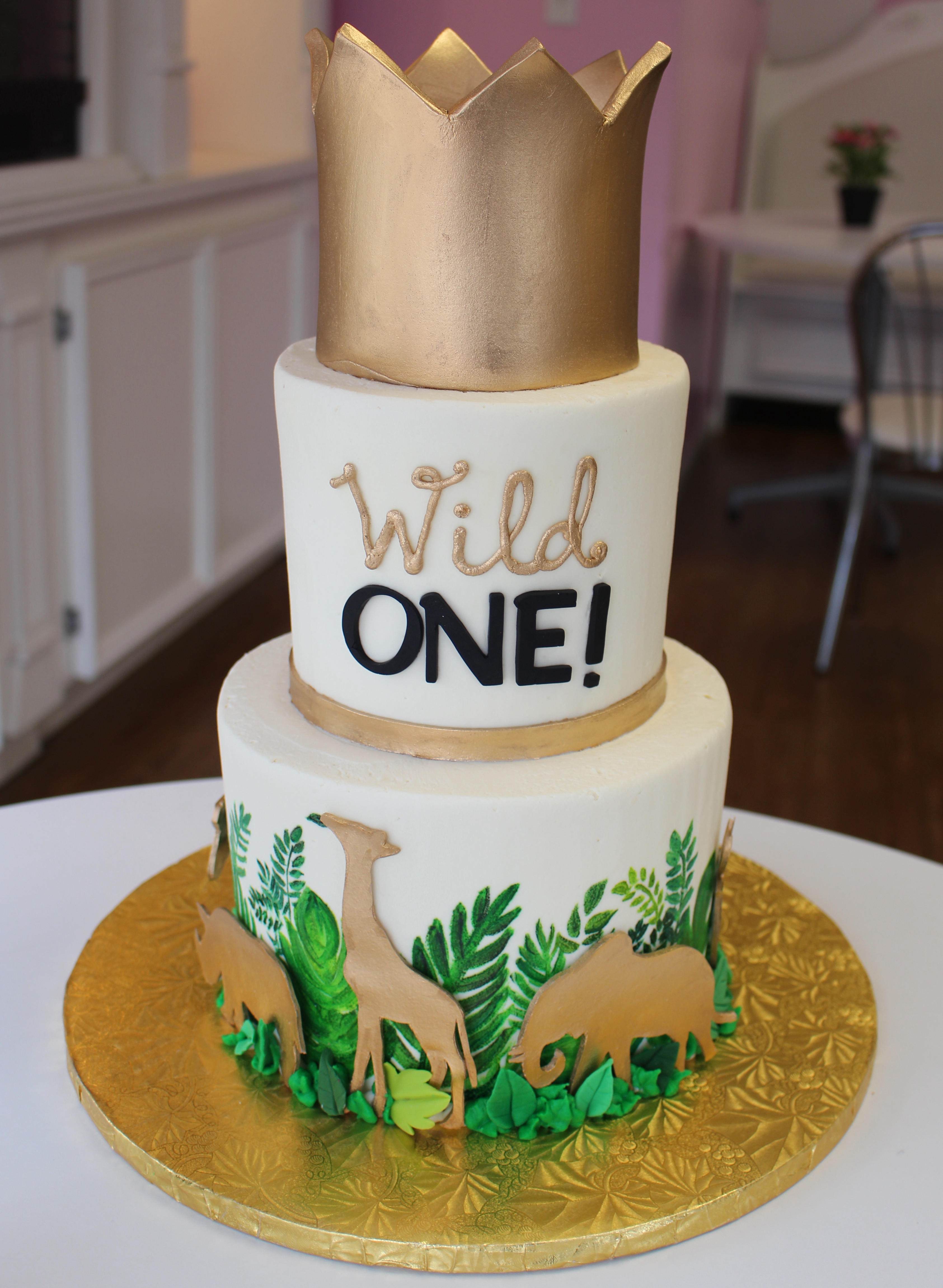 Two Tier Safari Theme First Birthday Cake with Painted Leaves Fondant Crown and Animals