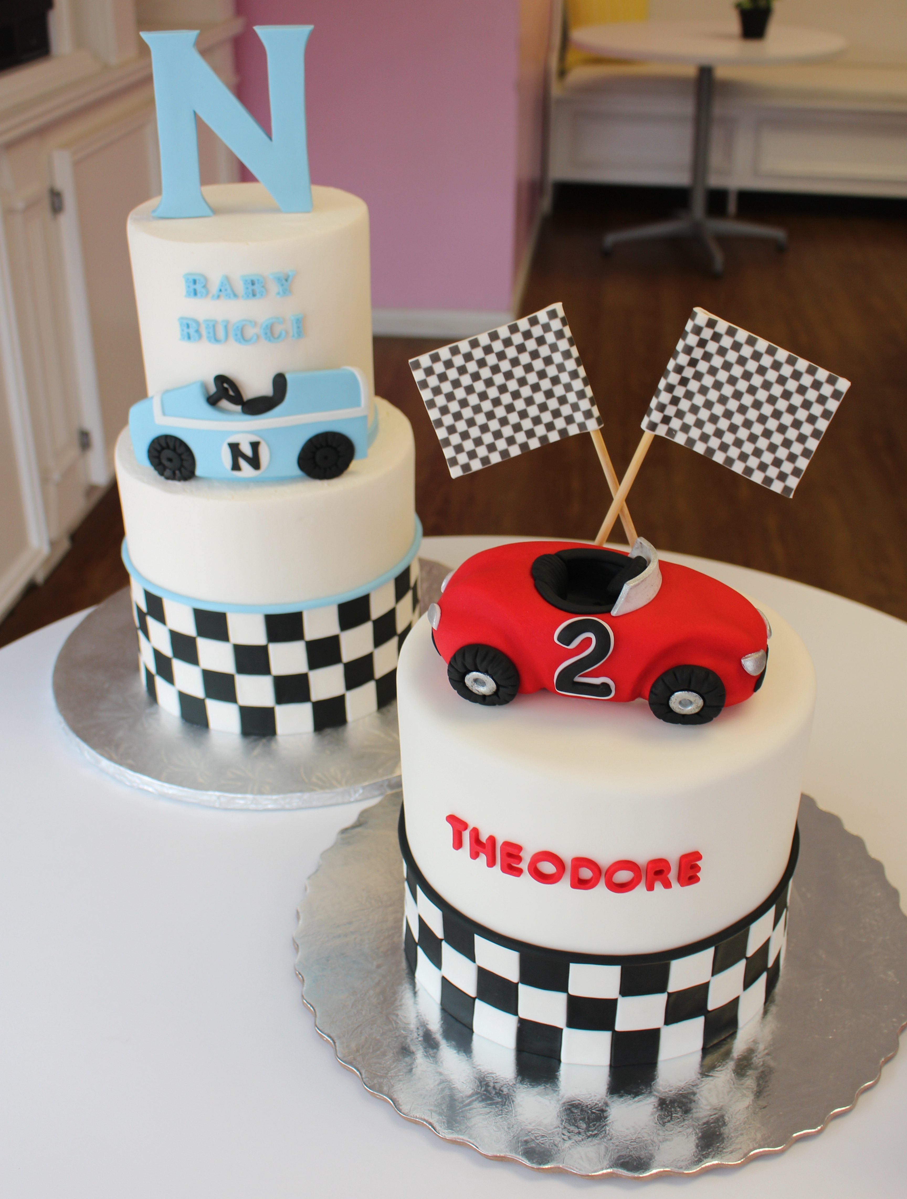 White Minimalist Racing Themed Kids Birthday Cakes with Fondant Race Cars and Checkered Flag Pattern
