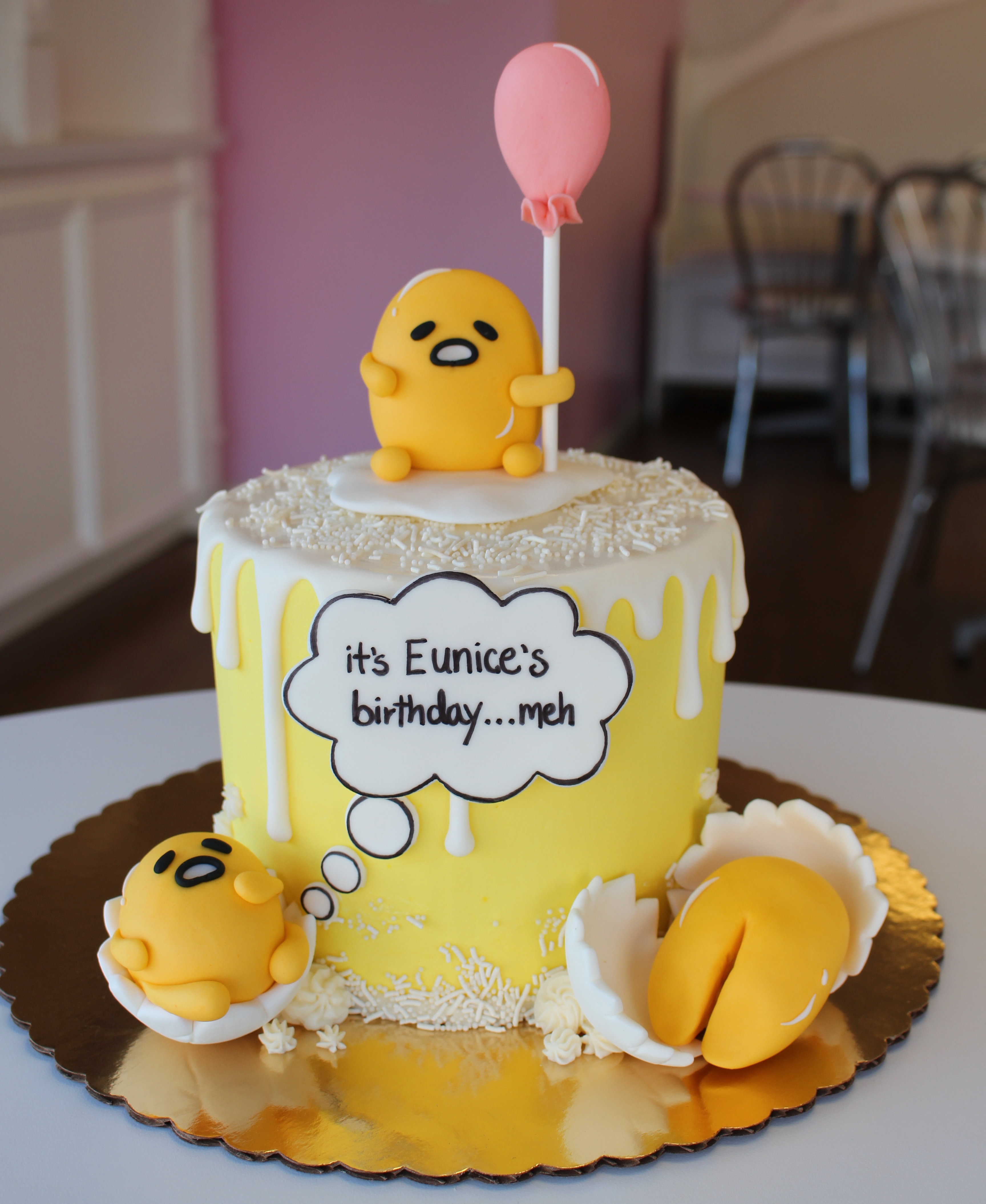 Yellow and White Gudetama Themed Drip Cake with Fondant CharactersBalloon and Egg Shells